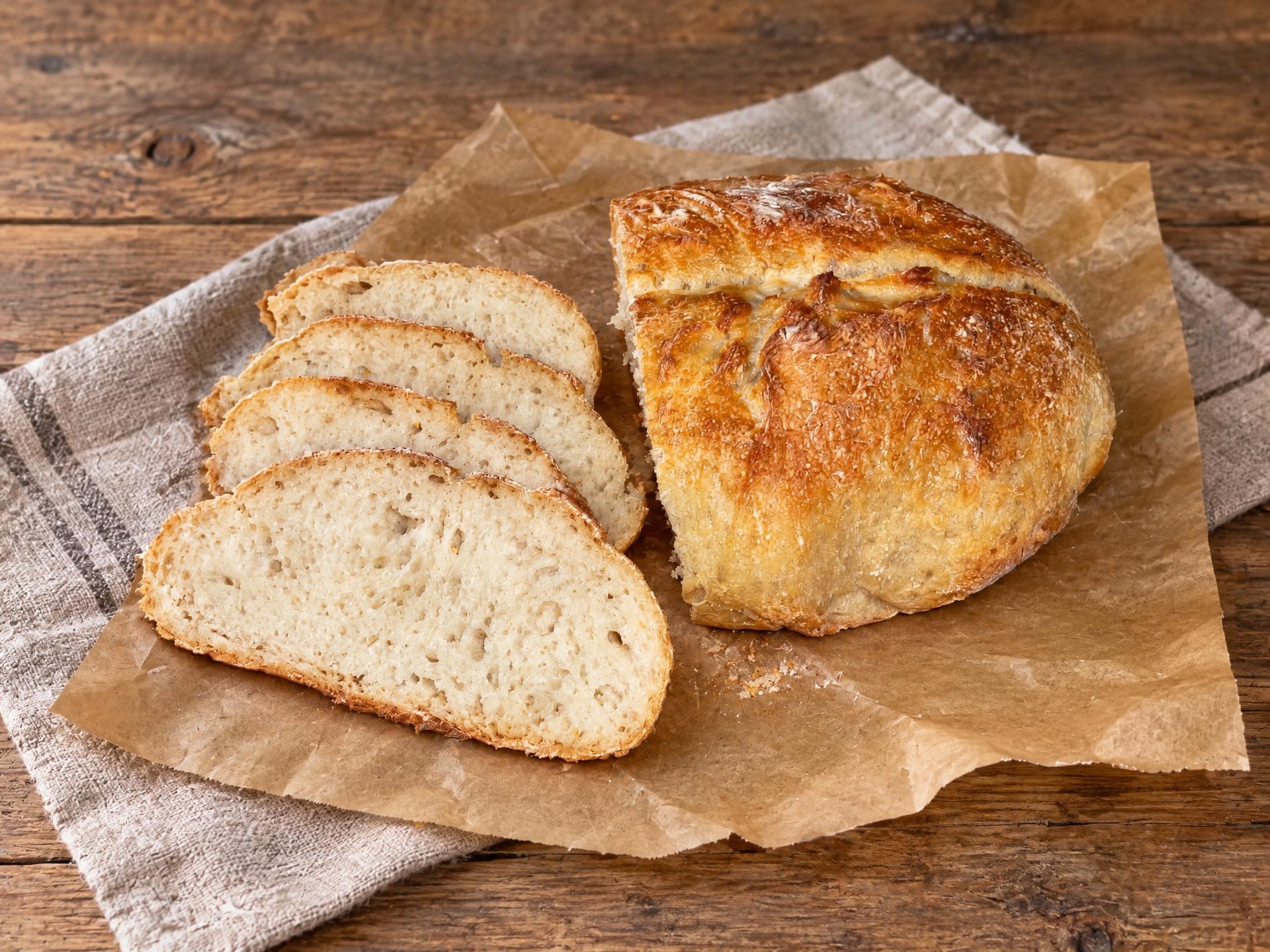 Freshly sliced sourdough boule with fanned slices